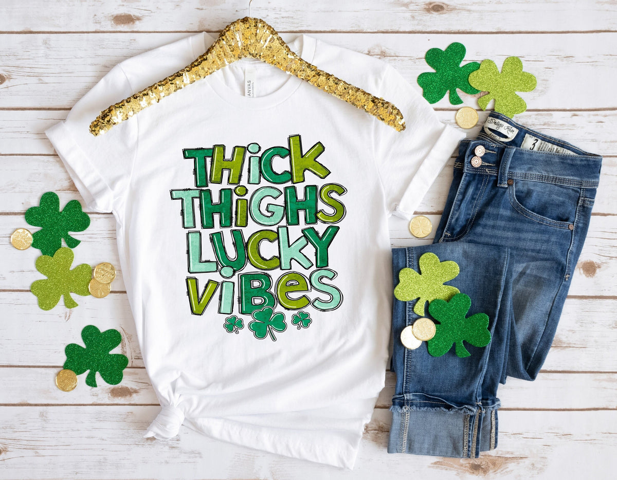 Thick Thighs Lucky Vibes ShirtSt Patricks Day ShirtShamrock Lucky LipsFour Leaf CloverShamrock ShirtsPatrick39s DayIrish Tshirt Graphic Tee – Aesthetic Look · Trending Graphic Apparel