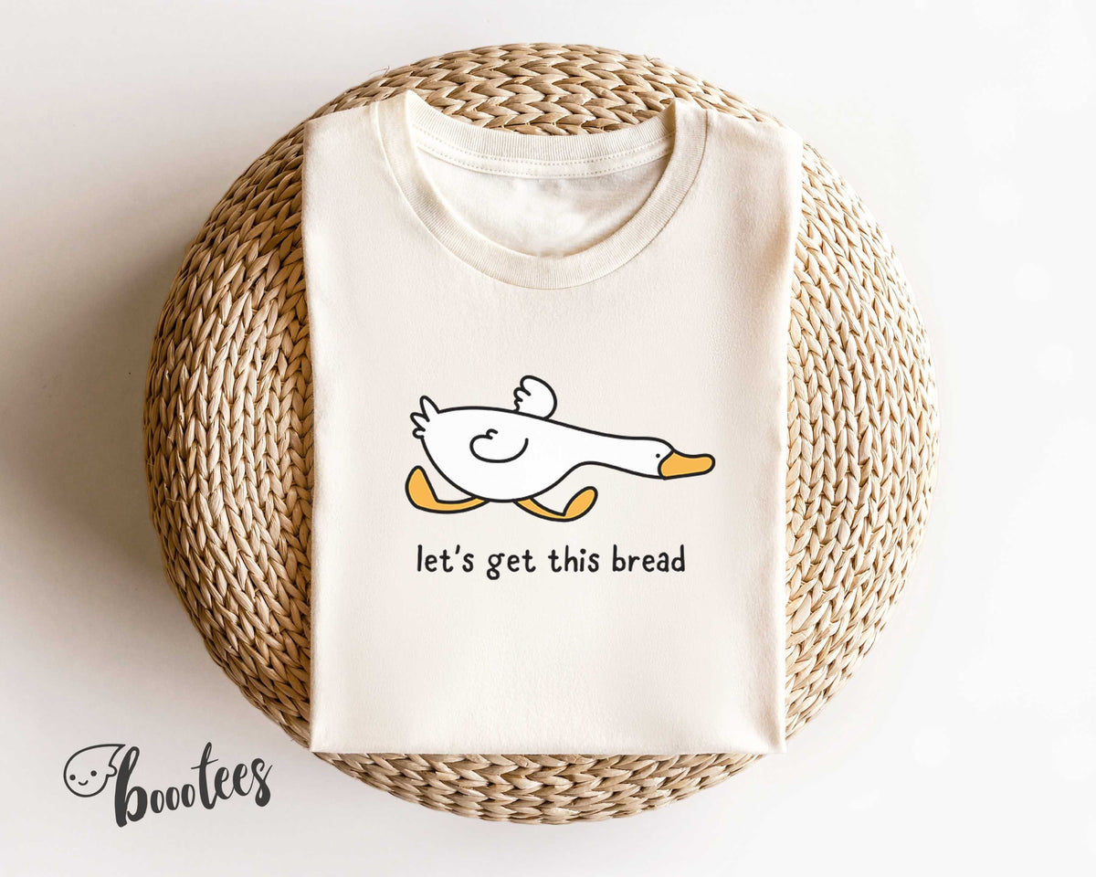 Let39s Get This Bread Funny T Shirt Duck Shirt Meme T shirt Gift Idea Tee Tshirt Bird Nerd Silly Animal Graphic Side Hustle Boss Money Graphic Tee – Aesthetic Look · Trending Graphic Apparel