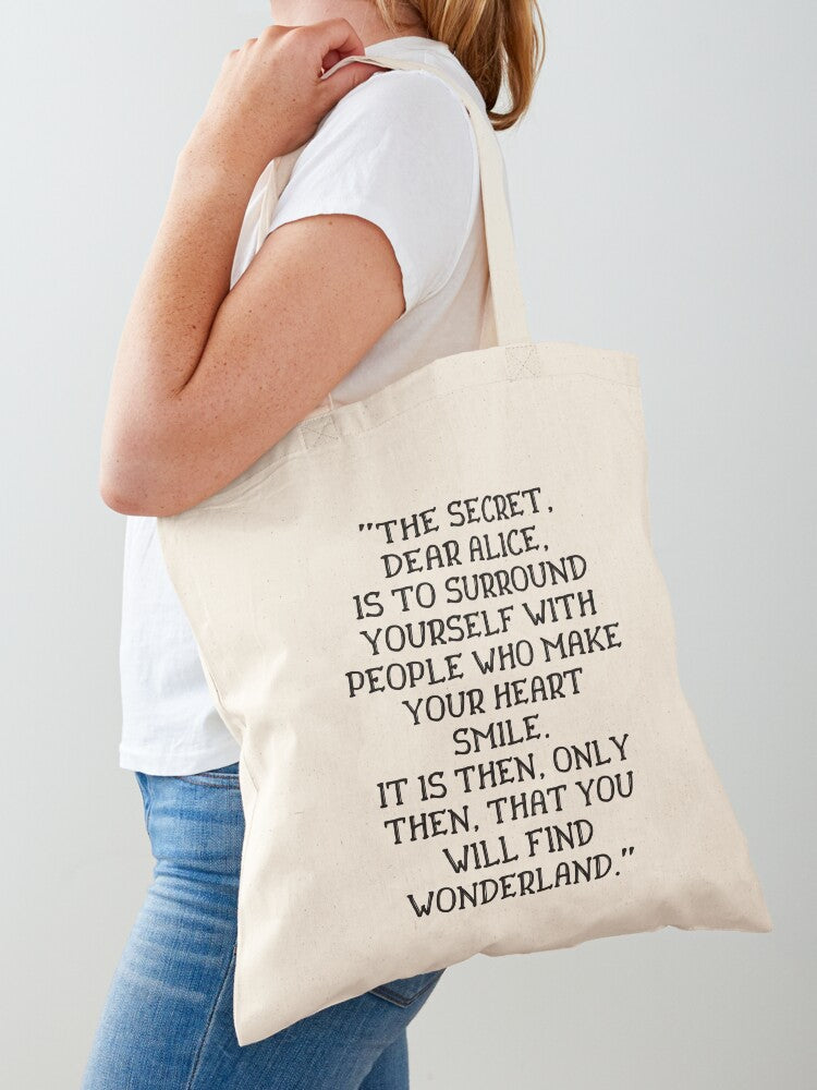 The secret dear Alice is to surround yourself with people who make your heart smile Alice in Wonderland quote Tote Bag